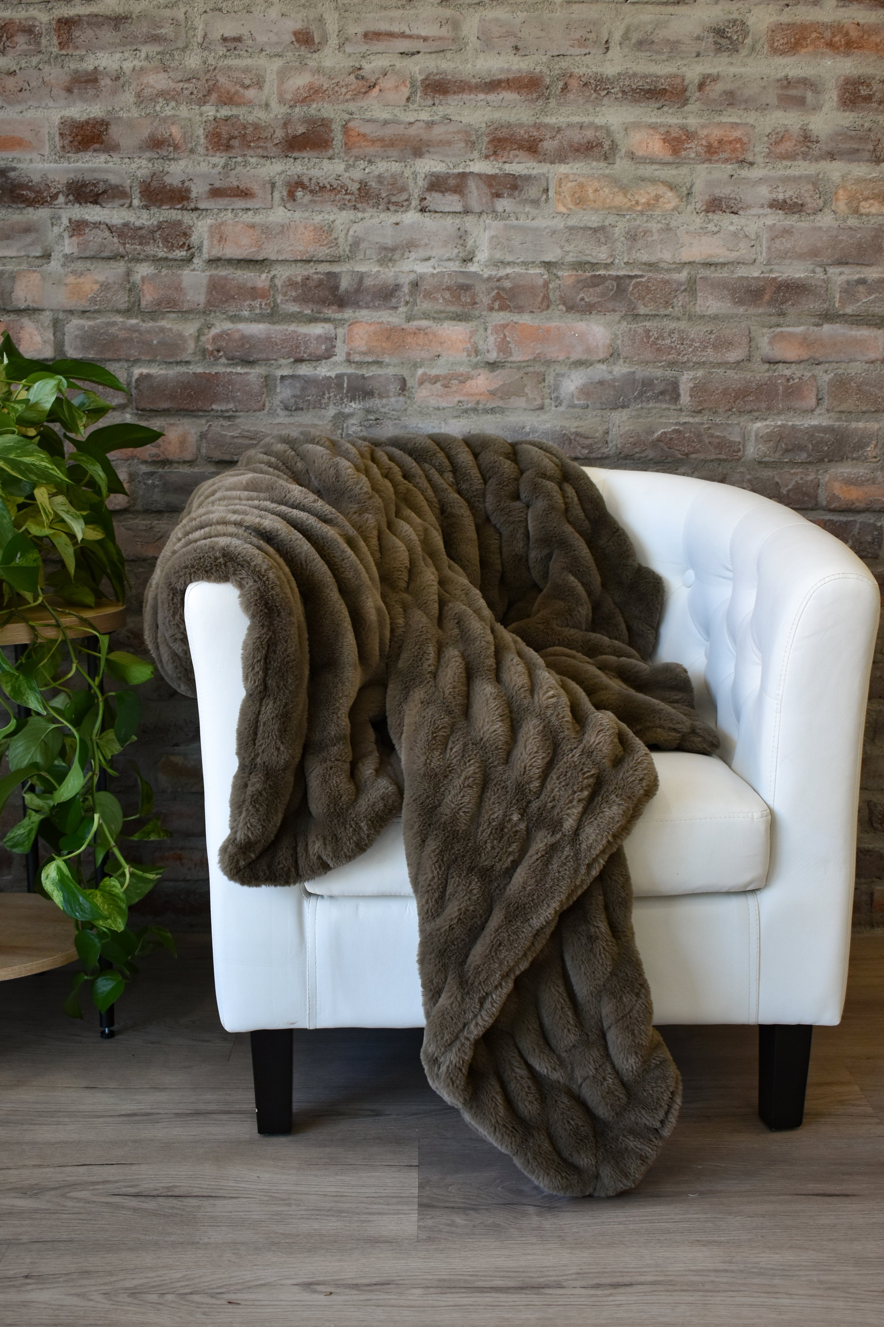 Mocha Mist faux fur throw blanket on chair — Poppy Blankets